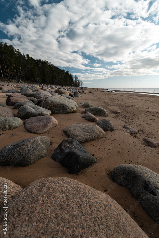 Veczemju Klintis - Boulder beach in Baltic country Latvia in April 2019 - Cloudy sky with dull clouds and a bit of sun Veczemju Klintis - Boulder beach in Baltic country Latvia in April 2019 - Cloudy sky with dull clouds and a bit of sun