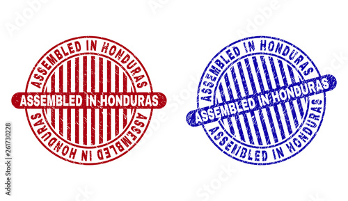 Grunge ASSEMBLED IN HONDURAS round stamp seals isolated on a white background. Round seals with grunge texture in red and blue colors.