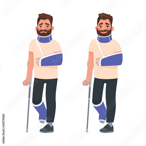 Sad and happy man with a broken arm and leg in a cast with a crutch and a fixing collar around his neck