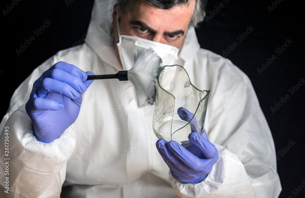 Expert Police get fingerprints from a broken glass bottle in Criminalistic Lab, conceptual image Expert Police get fingerprints from a broken glass bottle in Criminalistic Lab, conceptual image