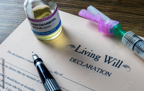 Living will declaration form Next to a vial of pentobarbital sodium to proceed to euthanasia, conceptual image photo