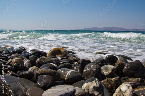Pebble beaches of the Aegean Sea on the island of Kos © leomalsam