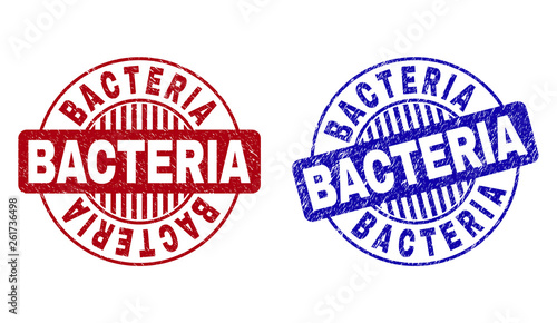Grunge BACTERIA round stamp seals isolated on a white background. Round seals with grunge texture in red and blue colors. Vector rubber overlay of BACTERIA caption inside circle form with stripes.