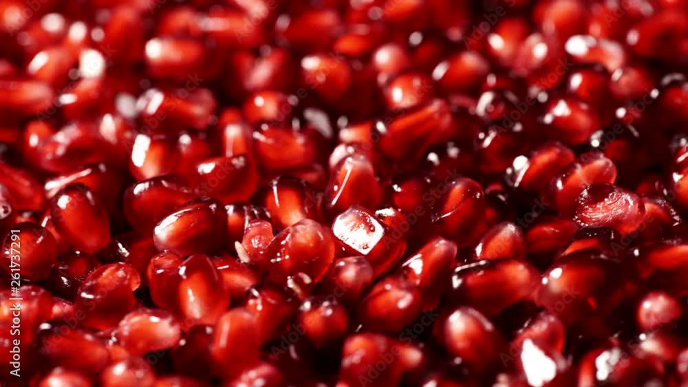 Delicious red ripe juicy pomegranate seeds close up Delicious red ripe juicy pomegranate seeds close up