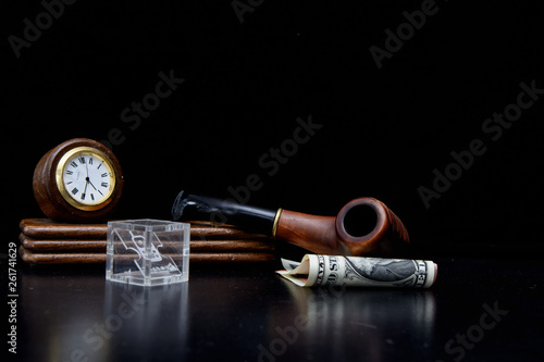 Wallpaper Mural Table set with a clock and a number of smoking pipe lies on the dollar and euro bills. Glass cube with a mobile phone icon. Concept - business without vacation Torontodigital.ca