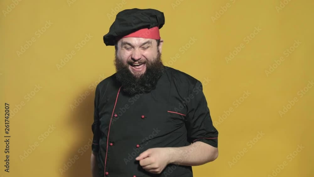 cook in a black suit on a yellow background cook in a black suit on a yellow background