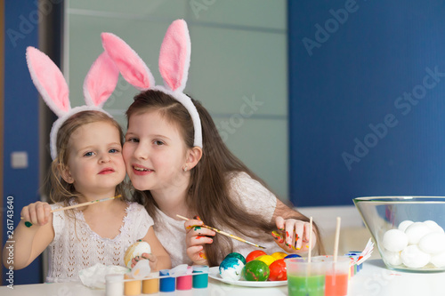  Girls paint easter eggs