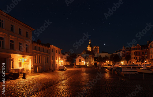 The old town of Stralsund at night beautifully lit with lanterns and charming cobblestones