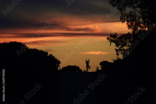 Happy yoga woman on sunset © Rui_Bento87