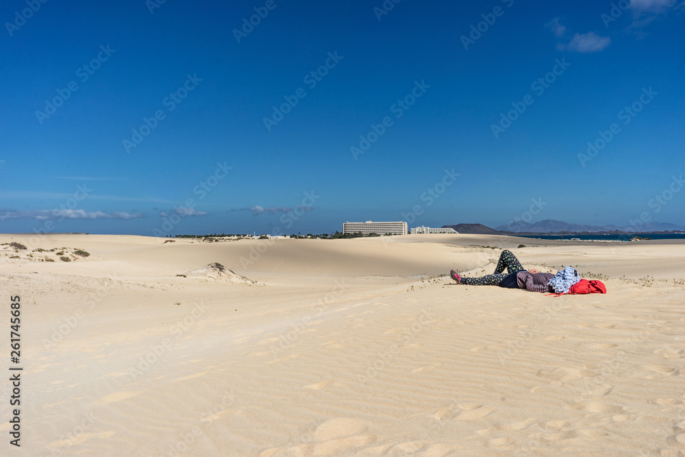 person sleeping in the desert