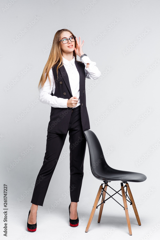 Portrait of beautiful elegant lady standing with black chair isolated on white studio! Portrait of beautiful elegant lady standing with black chair isolated on white studio!