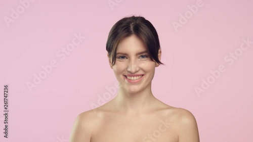 Young brunette woman throws out women shave razor and smiles.