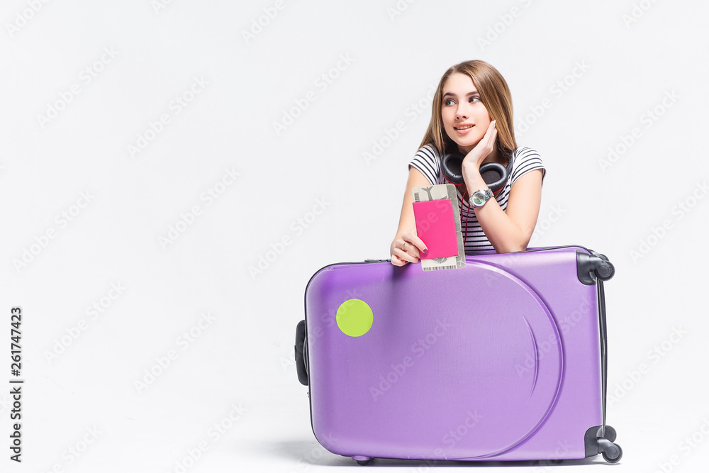 Travel and adventure concept. Beautifulwoman with a suitcase. Isolated on white background. Travel and adventure concept. Beautifulwoman with a suitcase. Isolated on white background.
