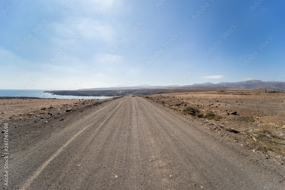Endless road in the desert of Fuerteventura at Canary Islands of Spain