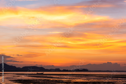 small boat in the sea with twilight sky in morning at koh mook, Trang province, Thailand