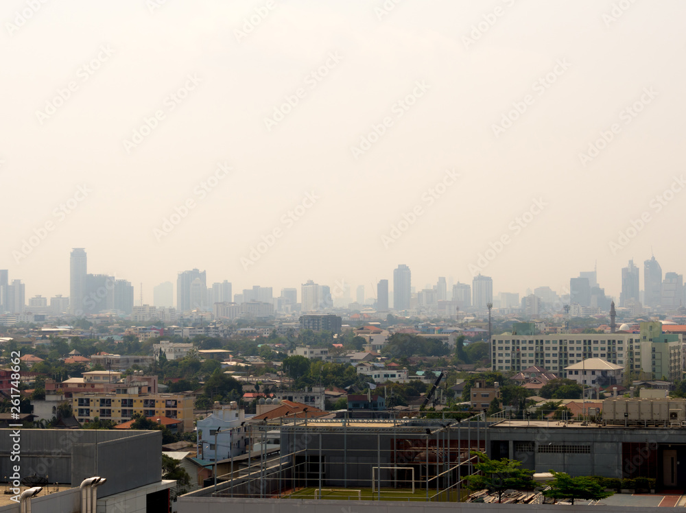 Cityscape urban skyline in the mist or smog. Wide and High view image of Bangkok city in the smog