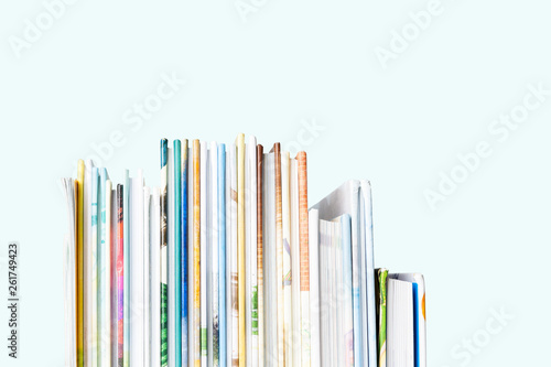 Cuadro en lienzo Close view of Stack of children's books on a pastel blue background
