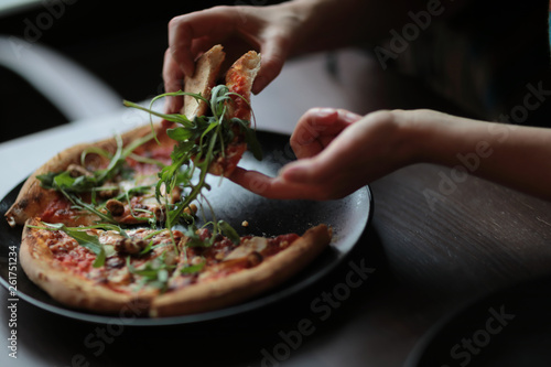 Photography The tasty pizza on the beautifull plate in cafe