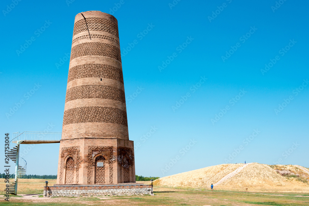Tokmok, Kyrgyzstan - Aug 08 2018: Ruins of Burana Tower in Tokmok, Kyrgyzstan. It is part of the World Heritage Site - Silk Roads: the Routes Network of Chang'an-Tianshan Corridor.