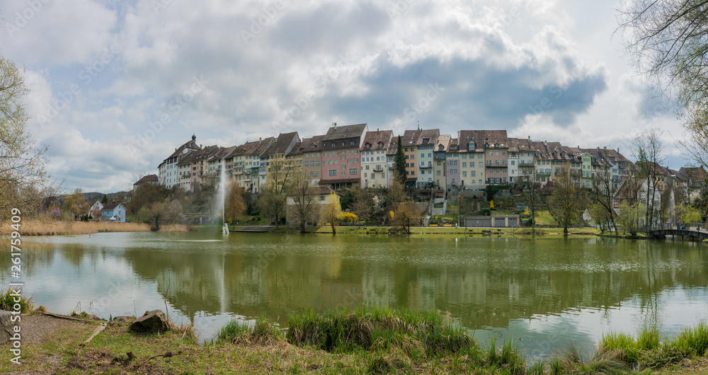 Wil, SG / Switzerland - April 8, 2019: view of the historic old town in the Swiss city of Wil with the city pond and park in the foreground