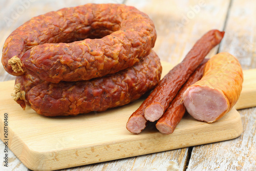 Selection of traditional Polish pork sausage on wooden surface