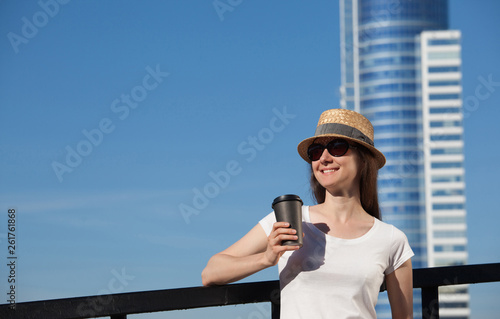 Portrait of a beautiful young woman with a cup of coffee