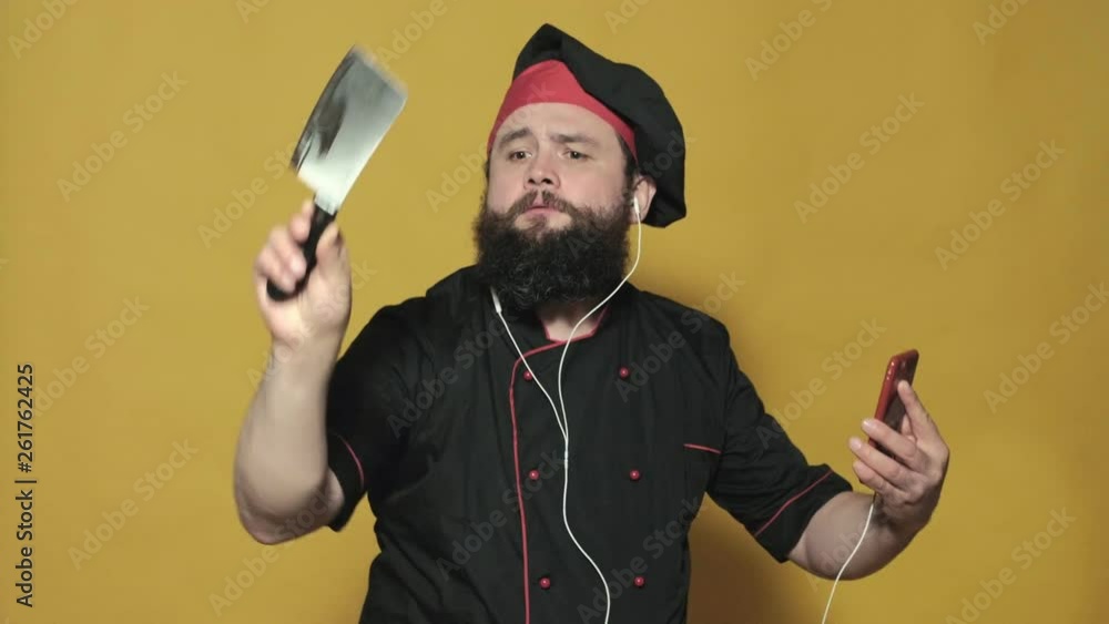 cook in a black suit on a yellow background cook in a black suit on a yellow background