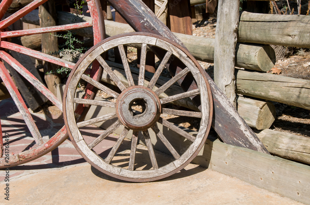 Old wooden wheel isolated on white background.