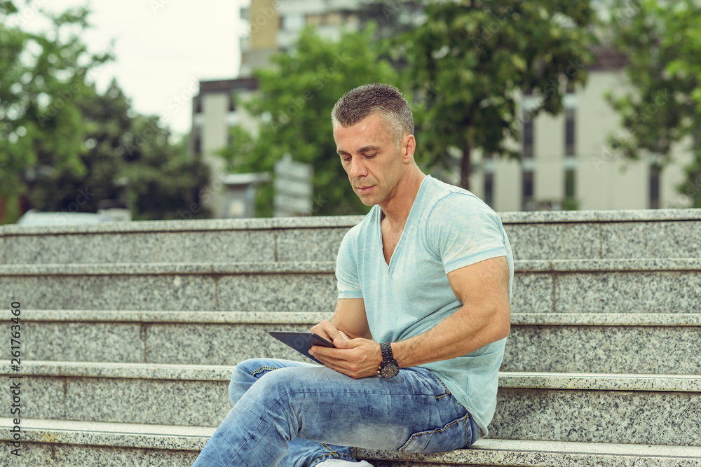 Handsome Man Outdoors using Mobile Devices Handsome Man Outdoors using Mobile Devices