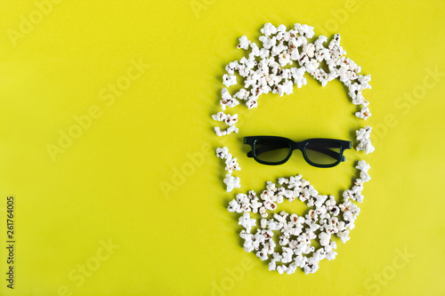 Abstract image of man viewer, 3D glasses, popcorn. Cinema time on blue paper background. Concept cinema movie and entertainment. Top down composition copy space