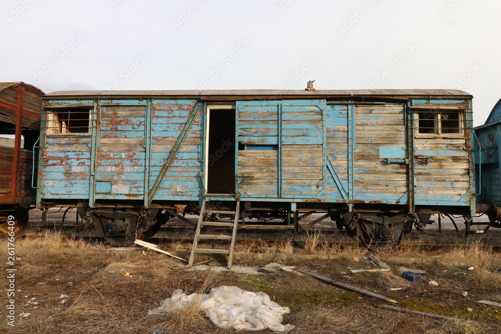Abandoned old railway wagons at station, old train wagons in an abandoned station Inside this train station still stay wagons since the station was closed. Abandoned old railway wagons at station, old train wagons in an abandoned station Inside this train station still stay wagons since the station was closed.
