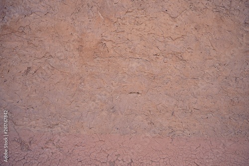 Dry cracking mud wall texture, natural background concept