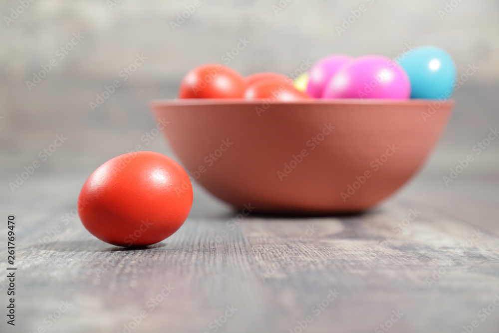 Multicoloured Easter eggs in a clay bowl Multicoloured Easter eggs in a clay bowl