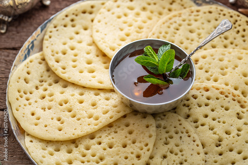 Close view of Morrocan pancakes Baghrir with honey
