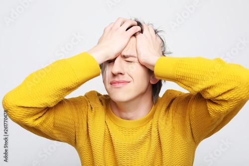 man with head pain on white background