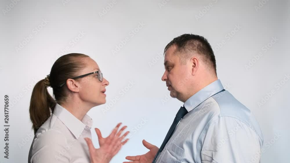 Businessman argue with business woman. The relationship between a man and a woman at work. Businessman argue with business woman. The relationship between a man and a woman at work.