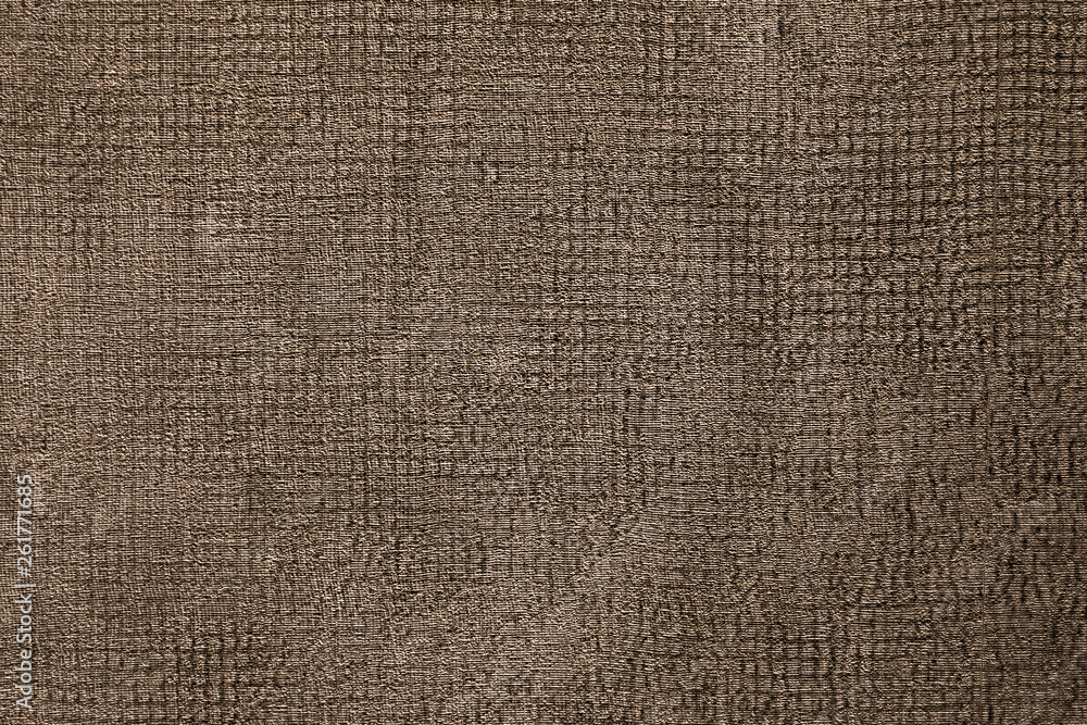 The texture of the fabric is burlap brown. Natural textiles rusty surface. Close-up, rectangular photo. The texture of the fabric is burlap brown. Natural textiles rusty surface. Close-up, rectangular photo.