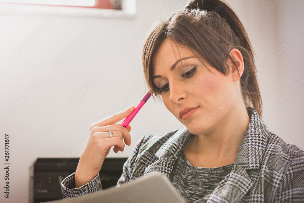 Natural looking young business woman with smile on her face and beautiful brown hair Natural looking young business woman with smile on her face and beautiful brown hair