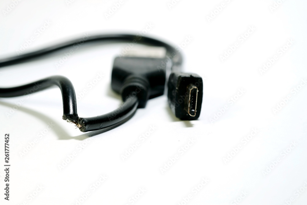 Isolate photo of damage USB cable on white background and space for write wording, consumable or connecting gadget using with smartphone or tablet, high risk of accident, burning and device quality Isolate photo of damage USB cable on white background and space for write wording, consumable or connecting gadget using with smartphone or tablet, high risk of accident, burning and device quality