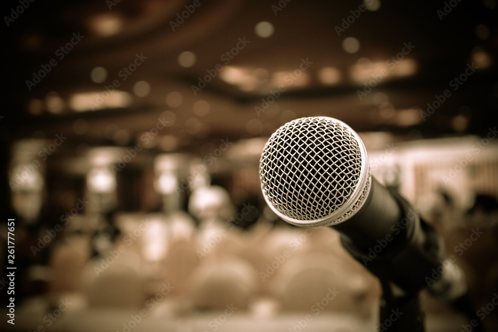 Microphones on abstract blurred of speech in seminar room or front speaking conference hall, blure light people in event meeting convention hall background, close up shot for copy space, Vintage tone Microphones on abstract blurred of speech in seminar room or front speaking conference hall, blure light people in event meeting convention hall background, close up shot for copy space, Vintage tone