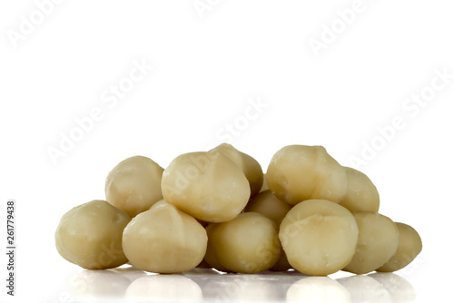 A handful of kernels of macadamia nuts isolated on white background.