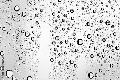 white isolated background water drops on the glass / wet window glass with splashes and drops of water and lime, texture autumn background