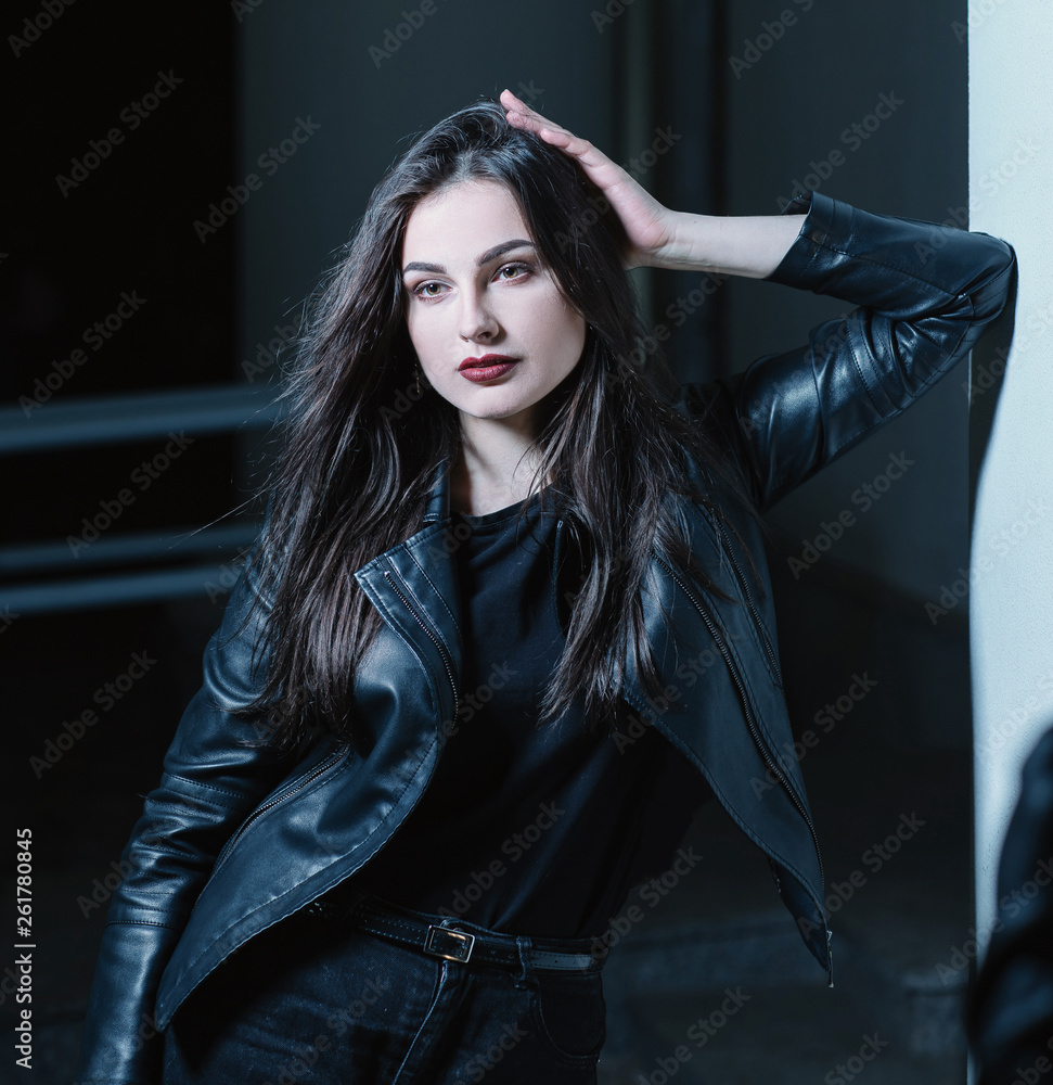 modern pensive young woman standing on the street