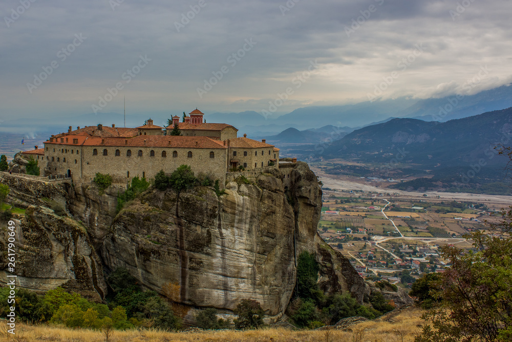 highland monastery medieval religion church castle building on top of steep rock dramatic scenic Greece landscape