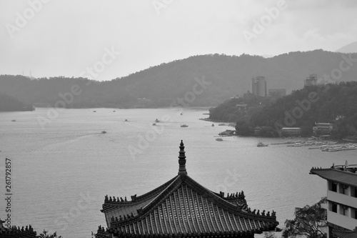 landscape of sun moon lake from tile roof of Xuanguang Temple in Taiwan photo