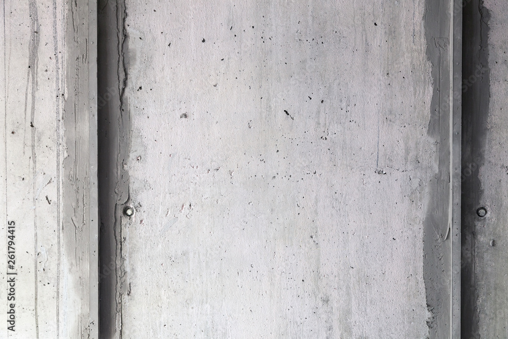 Texture background. Gray concrete wall with rough seams, mortar, plaster, abrasions, irregularities. Concept construction of country house, cottage, garage