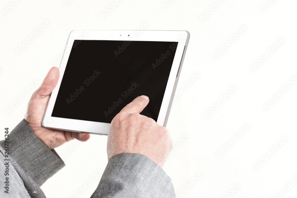 close up.businessman pointing finger at the blank screen tablet.isolated on white background close up.businessman pointing finger at the blank screen tablet.isolated on white background