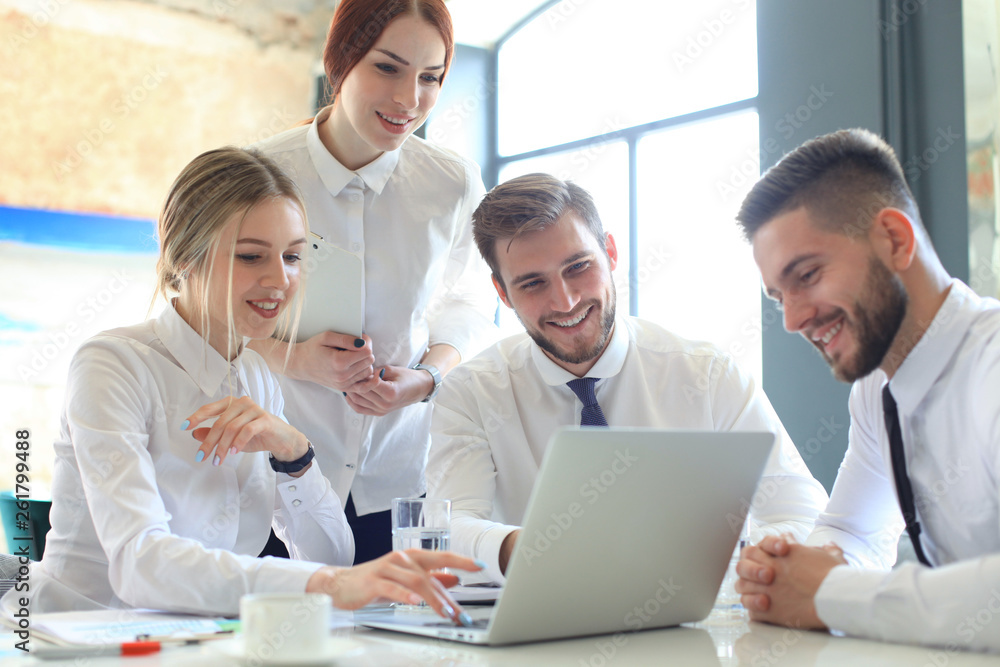 Group of business partners discussing ideas and planning work in office. Group of business partners discussing ideas and planning work in office.