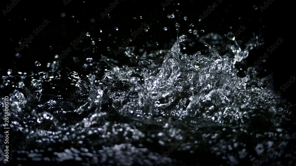 Blurry images of drinking water liquid wave or carbonate drink or oil shape or soda splashing and floating drop in black background for represent sparkling refreshment and refreshing Blurry images of drinking water liquid wave or carbonate drink or oil shape or soda splashing and floating drop in black background for represent sparkling refreshment and refreshing