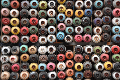 empty spray cans, colorful